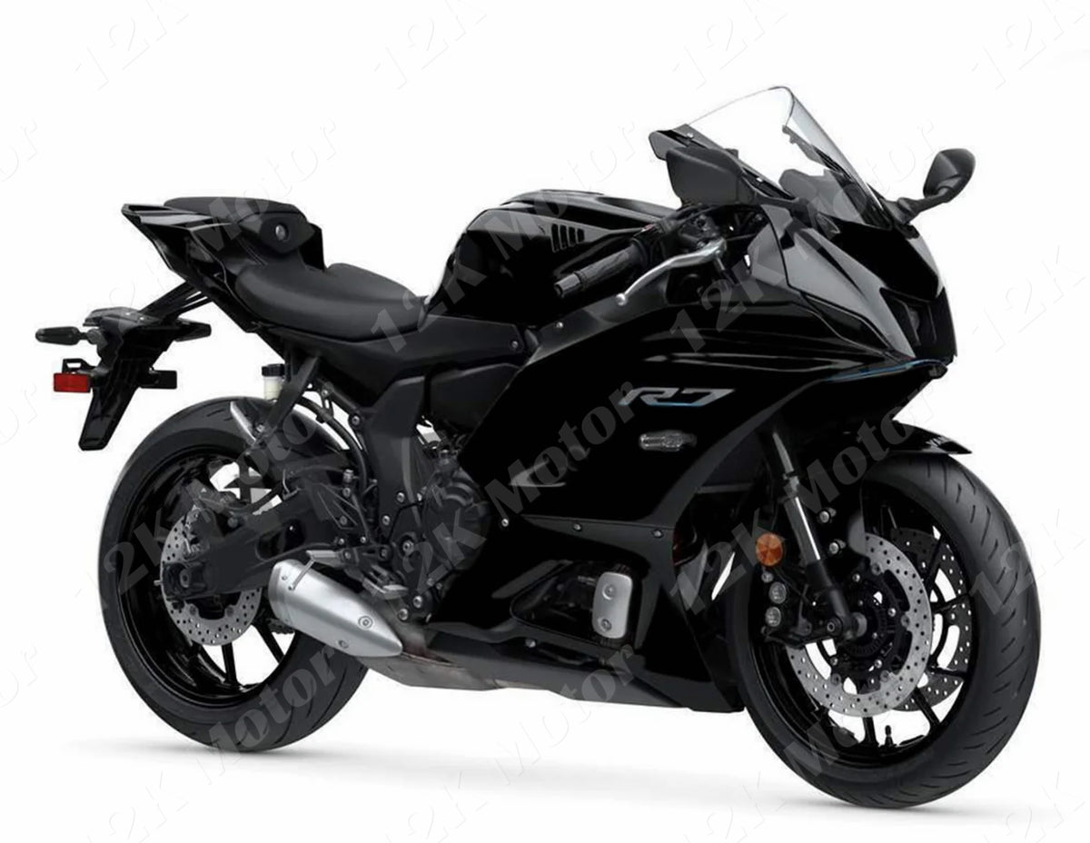 A black Yamaha R7 motorcycle with fairing kit installed.