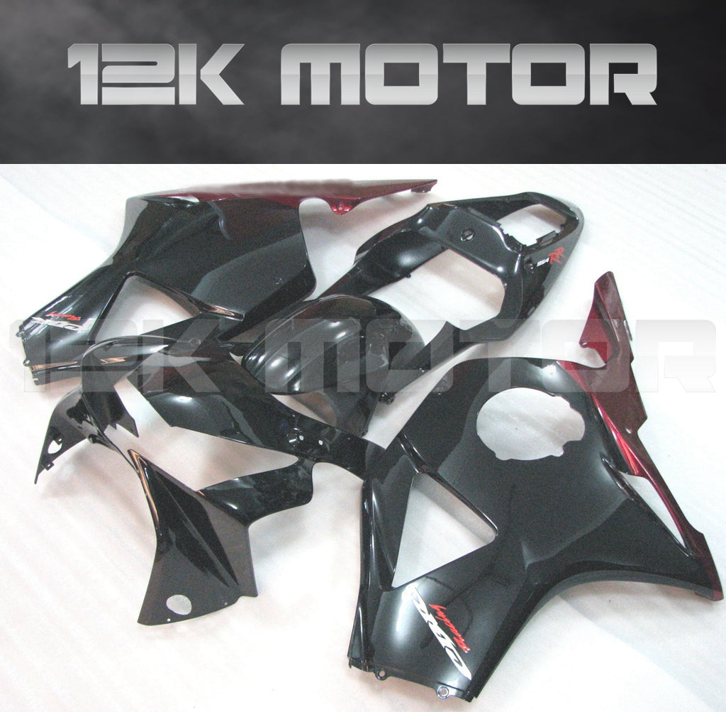 Aftermarket fairing kit for HONDA CBR954RR 2002 2003, displayed as various pieces in black with red accents, including a windscreen and fairing bolts set.