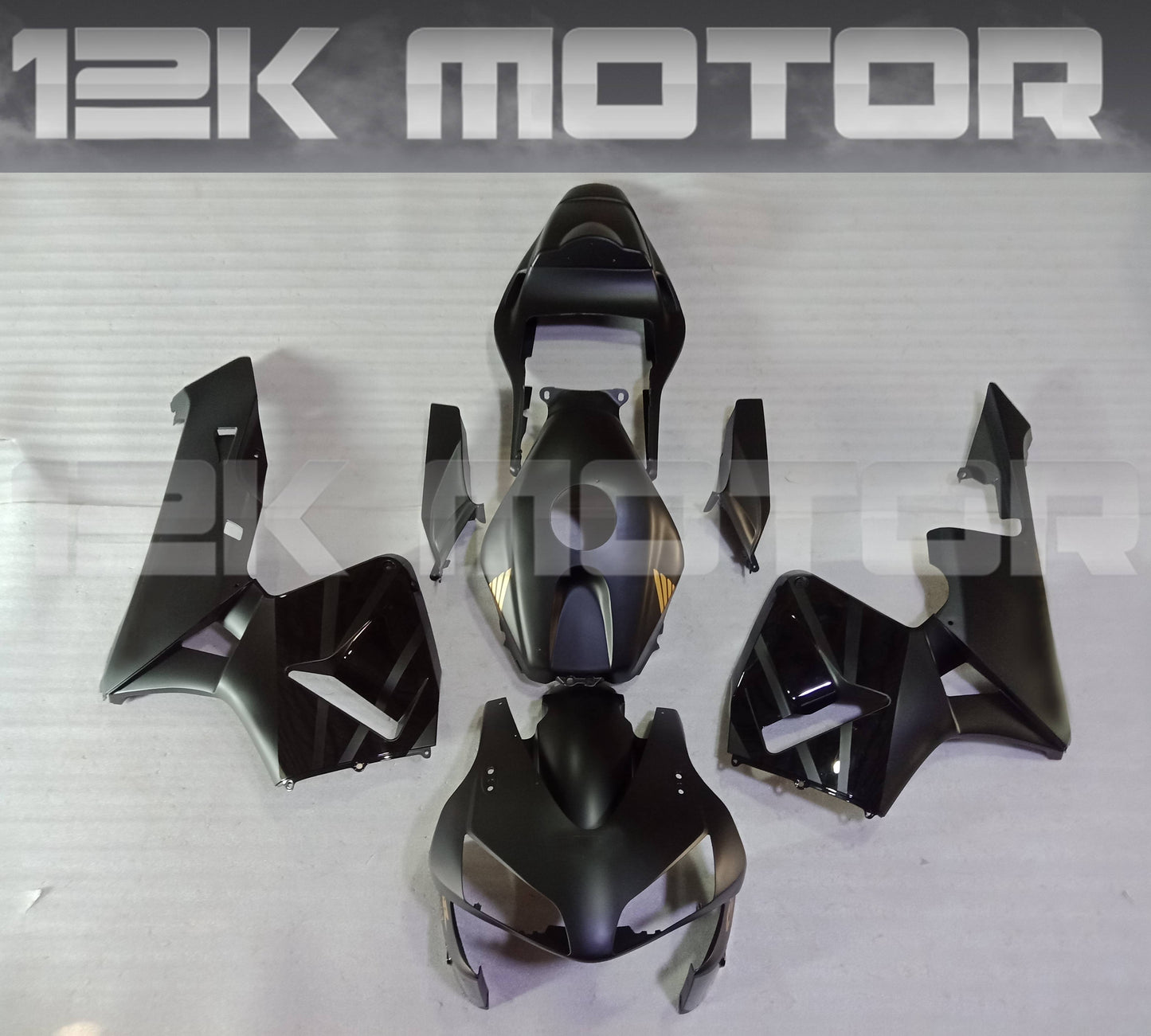 Aftermarket gold and black fairing kit for HONDA CBR600RR, displayed as various panels and parts without being assembled.