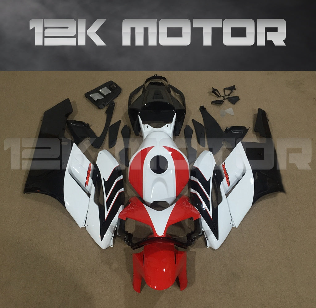 Aftermarket red, white, and black fairing kit for HONDA CBR1000RR 2004-2005 laid out on a flat surface with 12K MOTOR logo in the background.