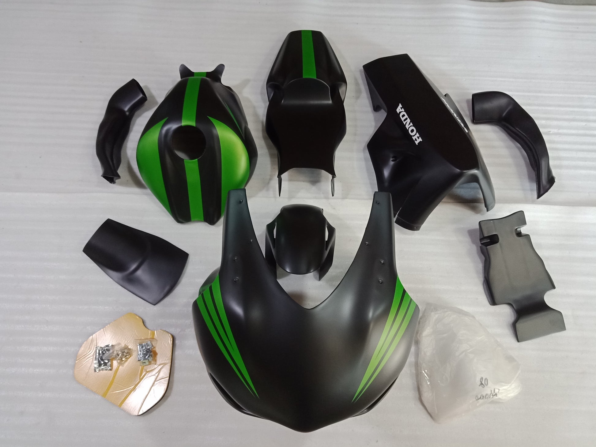 A set of unpainted motorcycle fairing parts for HONDA CBR1000RR, including the front fender, upper body, lower body, race tail, tank cover, and air tube.