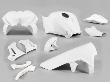 A set of white fiberglass motorcycle race fairings, including various components such as a front fender, upper body, lower body, race tail, and tank cover.
