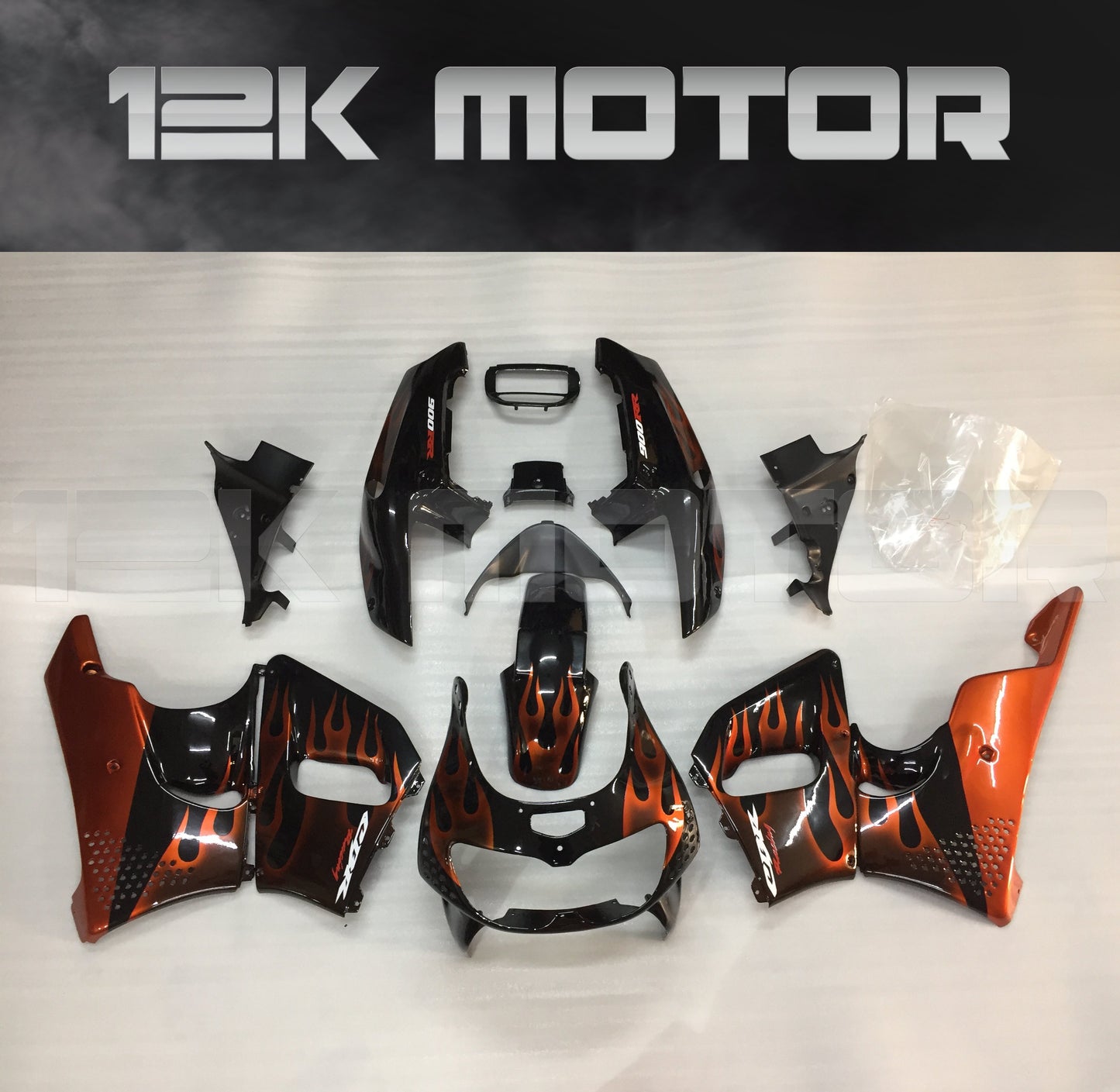 Aftermarket fairing kit for HONDA CBR900RR 1996 1997, consisting of various motorcycle fairing pieces in black, orange, and red colors laid out on a white background.