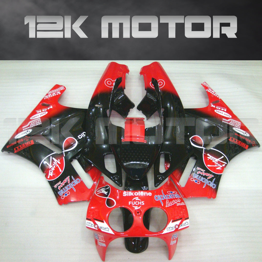 Aftermarket fairing kit for HONDA VFR400R in red and black with sponsor decals, including various panels and a windscreen.