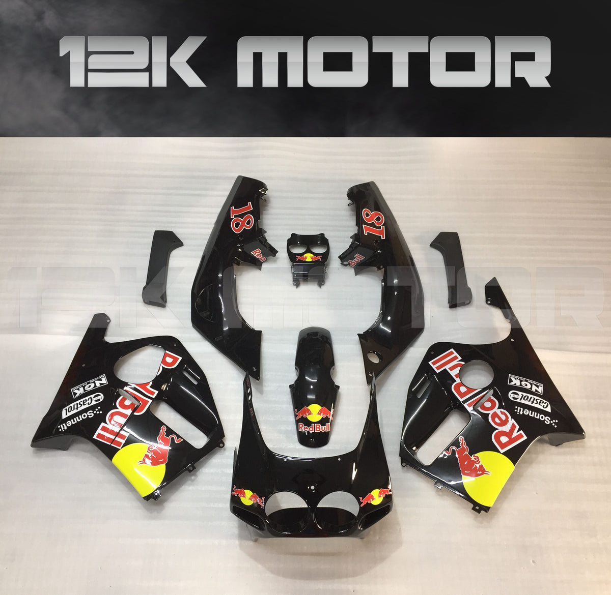 Aftermarket motorcycle fairing set for HONDA CBR250RR MC19 in black color with red bull branding.
