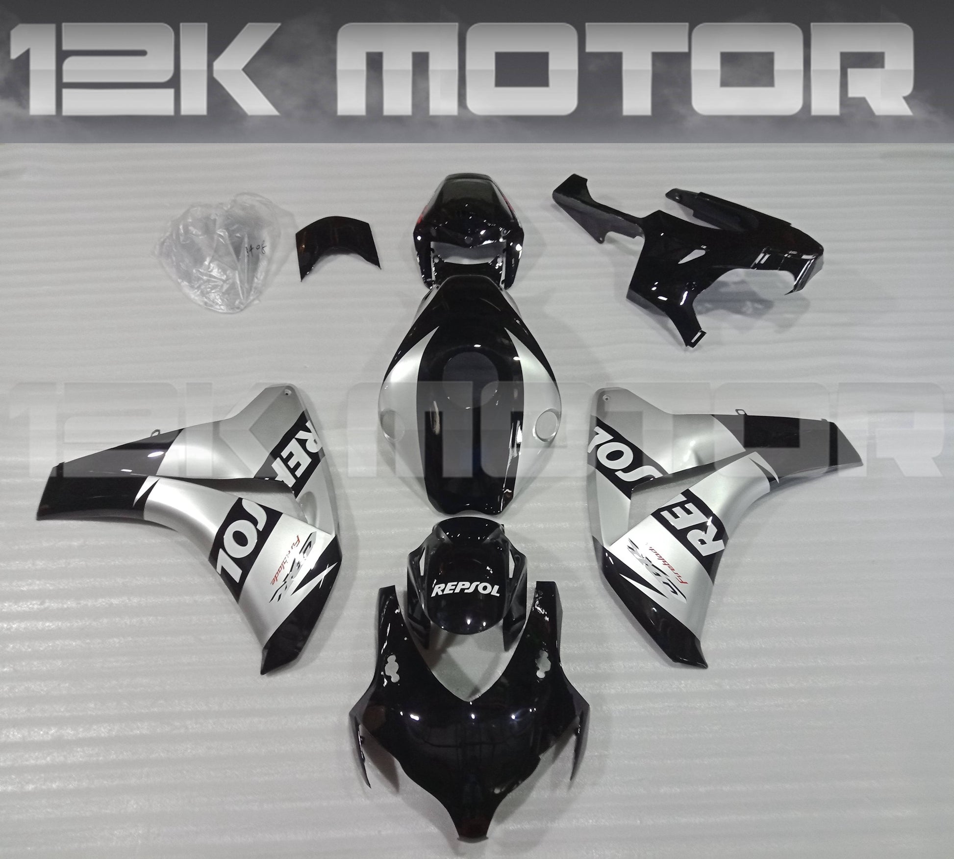 Aftermarket silver and black fairing kit for HONDA CBR1000RR, displayed without the motorcycle.