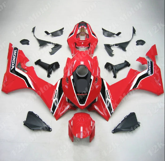 A red ABS fairing kit for Honda CBR1000RR-R 2020-2022 laid out on a white surface, including various panels and a heat shield.