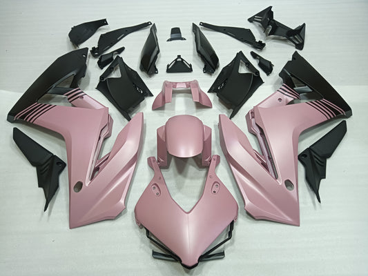 Pink and black motorcycle body parts on a white background