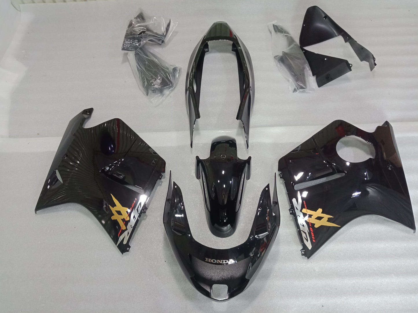 Motorcycle bodywork pieces with branding on a white background