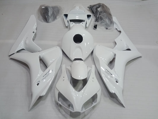 White fairing kit for Honda CBR1000RR motorcycle, displayed without being installed, including various panels and fairing parts.