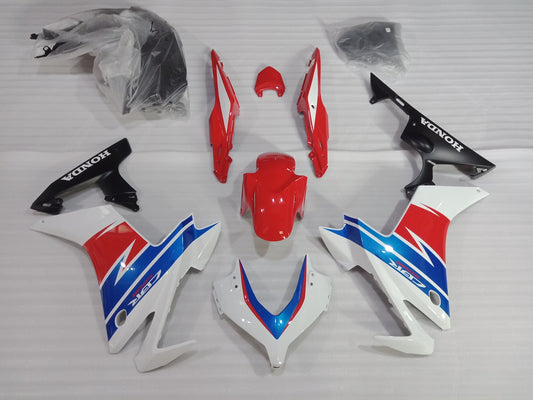 Aftermarket fairing kit for Honda CBR500R in red, white, and blue colors laid out on a white background, including various panels and fairing parts.