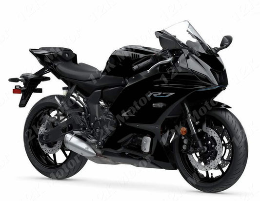 A black Yamaha R7 motorcycle with fairing kit installed.
