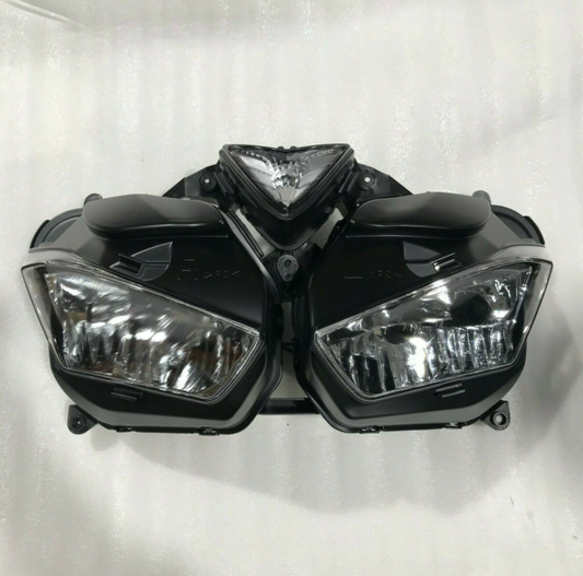 Pair of motorcycle headlights on a white background