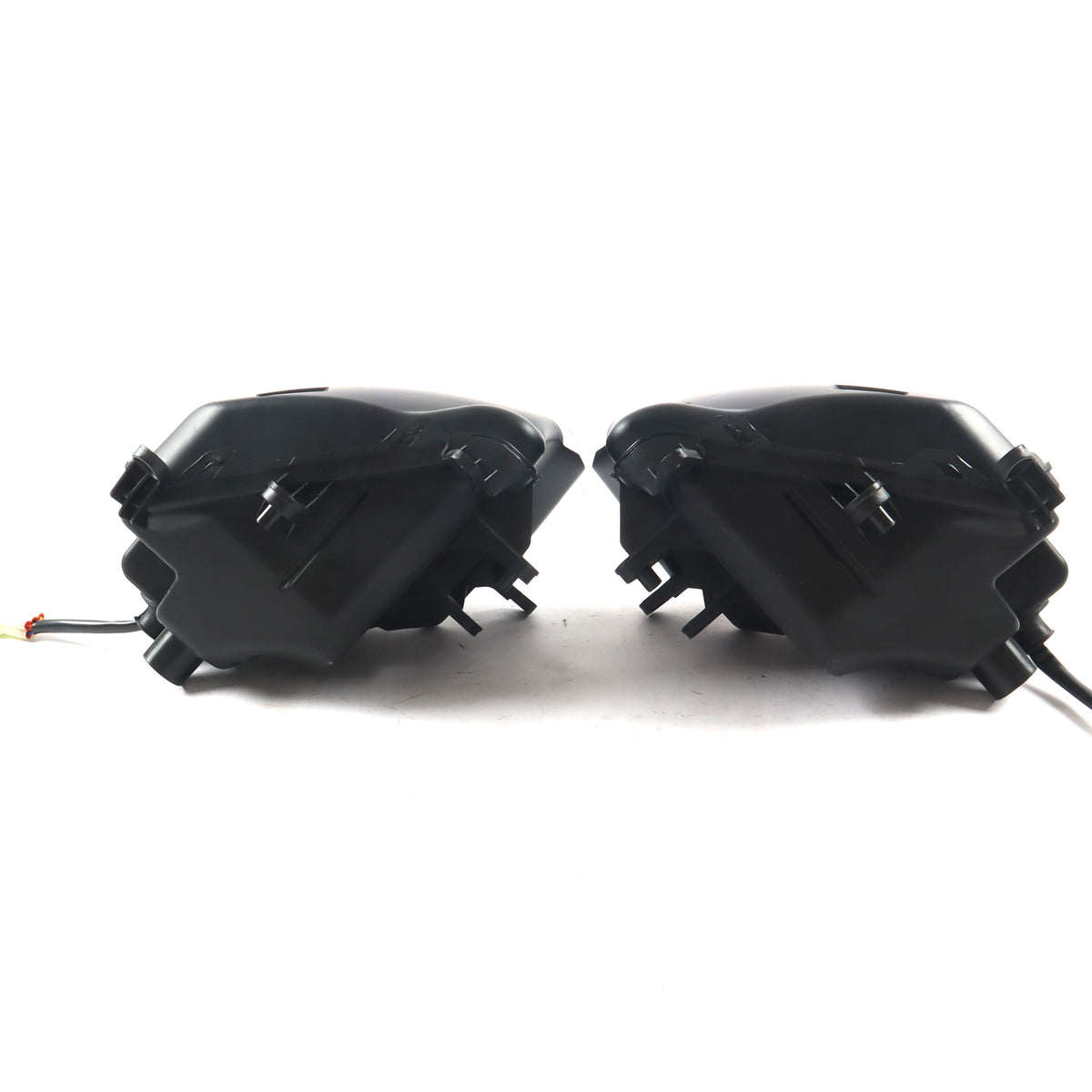 Two black motorcycle fairings on a white background