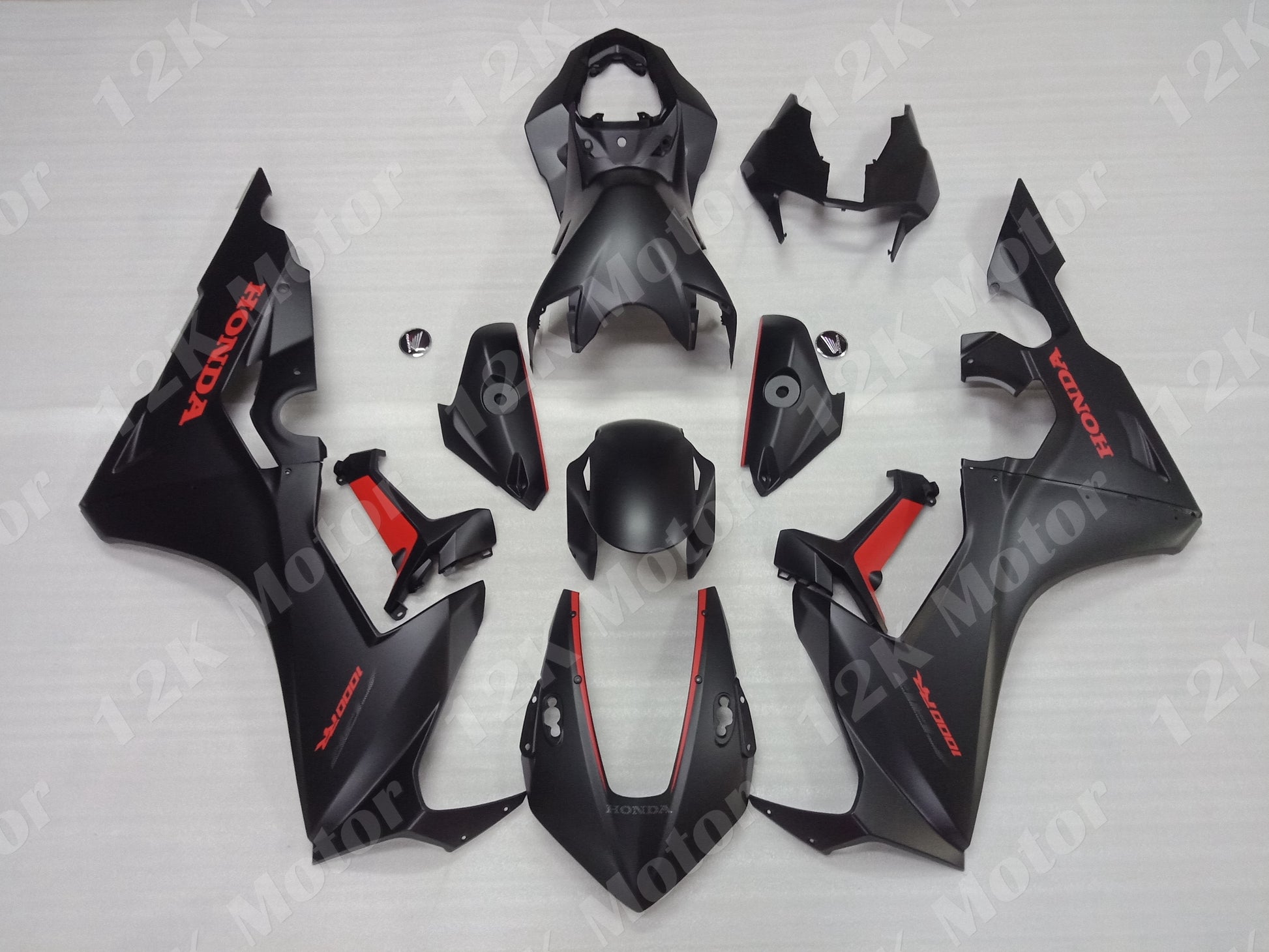 Set of matt black motorcycle fairings for HONDA CBR1000RR, including various panels and parts, laid out on a white background.