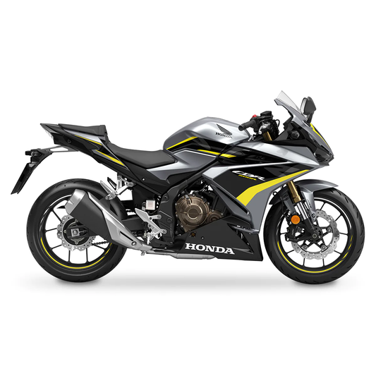 A silver, black, and yellow Honda CBR500R motorcycle with fairing kit panels.