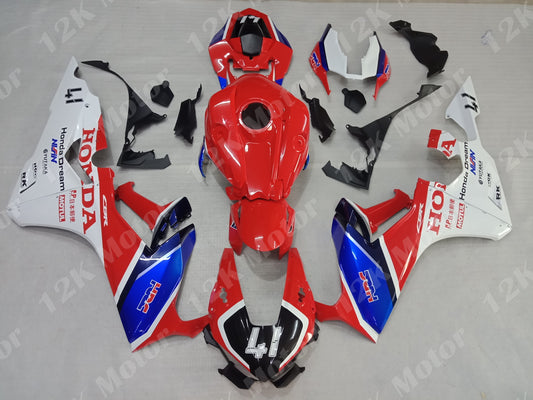 A set of motorcycle fairings for a Honda CBR1000RR in red, white, and blue color scheme, including various panels and parts.