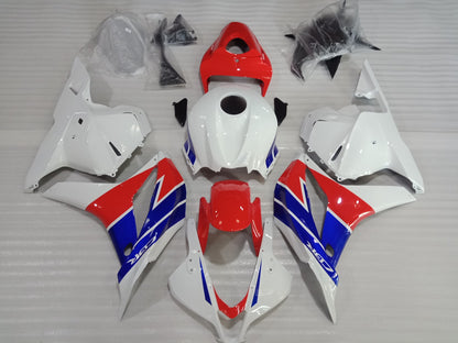 A set of motorcycle fairings for a Honda CBR600RR, featuring a tri-color scheme of red, white, and blue, including various panels and a windscreen.