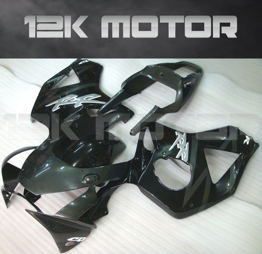 Aftermarket black fairing kit for HONDA CBR954RR 2002 2003 laid out on a white surface.