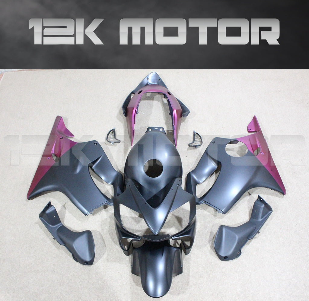 Aftermarket fairing kit for HONDA CBR600RR, consisting of multiple pieces in gray and pink color scheme, displayed on a flat surface.