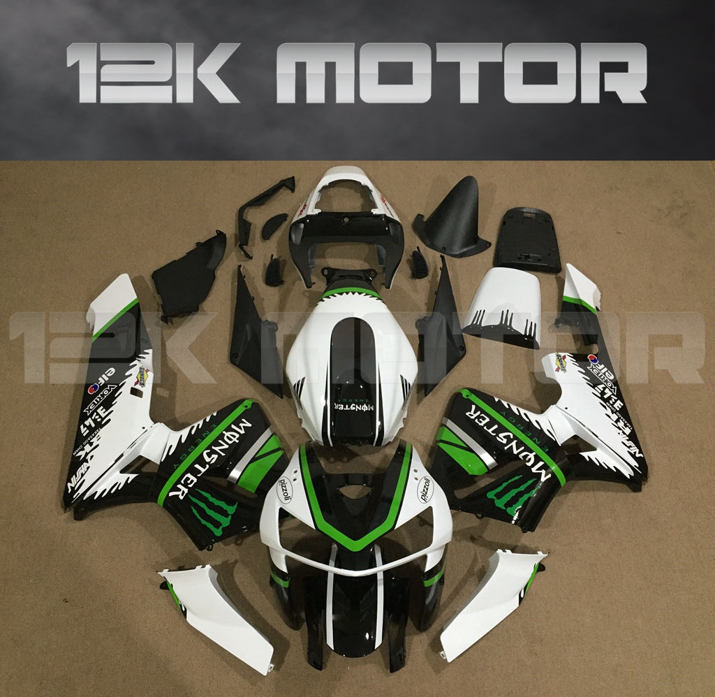 Aftermarket black and green fairing kit for HONDA CBR600RR displayed on a table with the brand name 12K MOTOR visible.