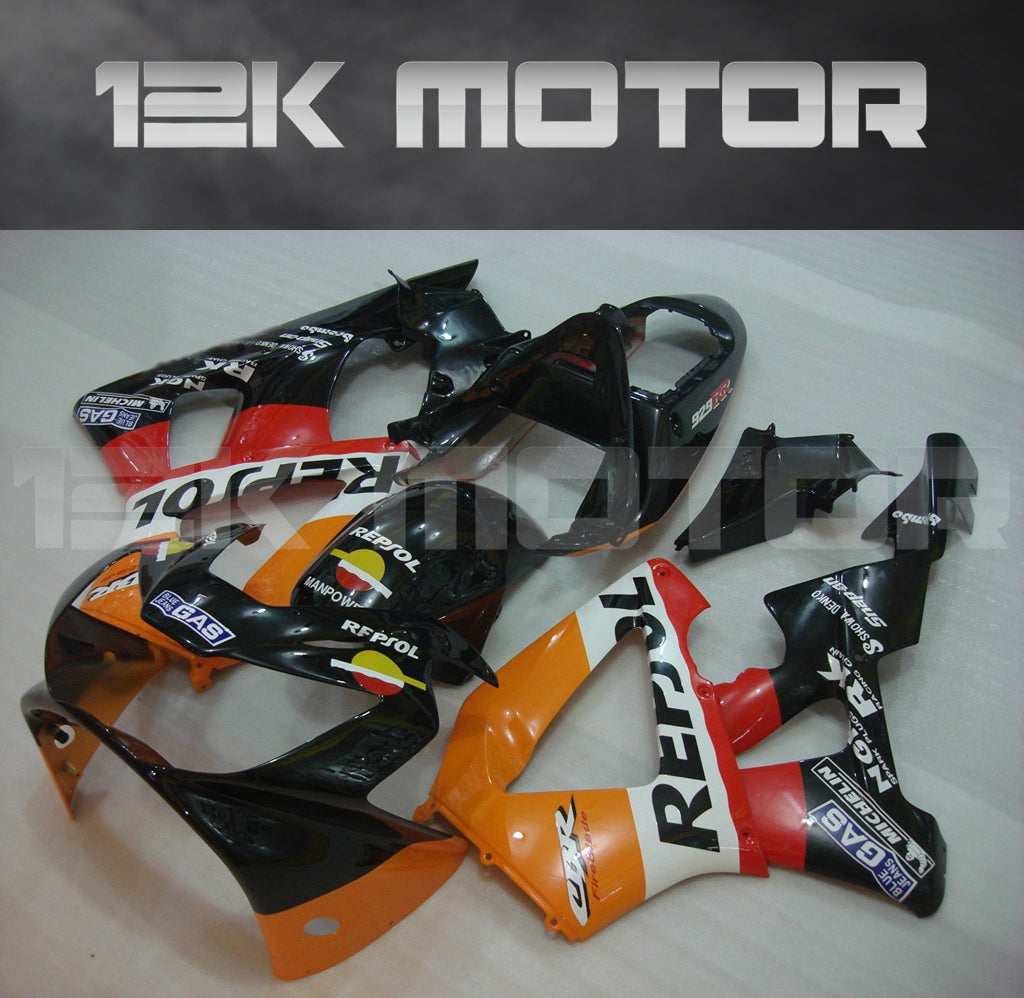 Aftermarket fairing kit for HONDA CBR929RR motorcycle, featuring black, orange, and white panels with text and graphics.