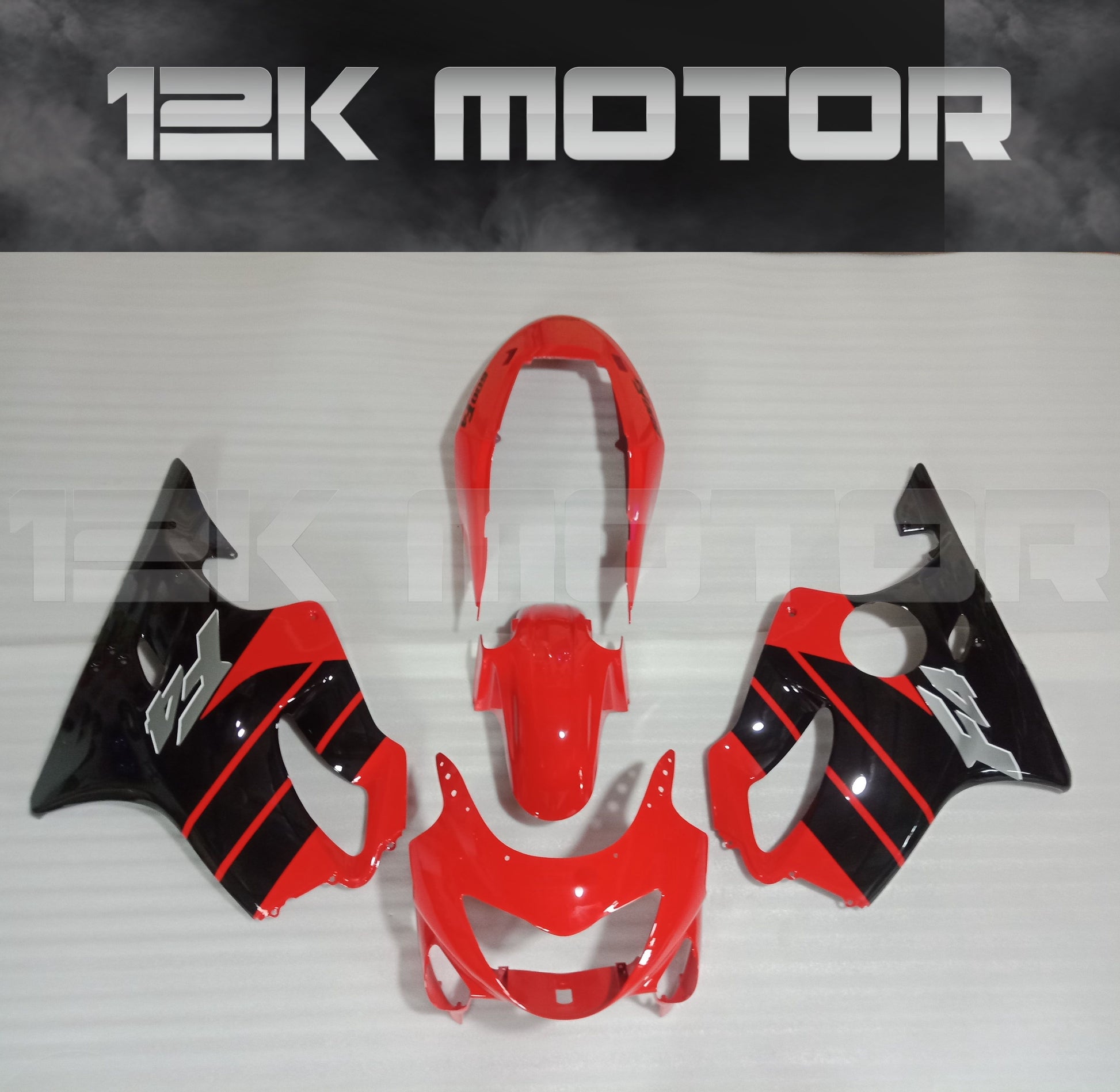 A red and black aftermarket fairing kit for HONDA CBR600 motorcycle, including front mudguard, upper fairing, and other panels.