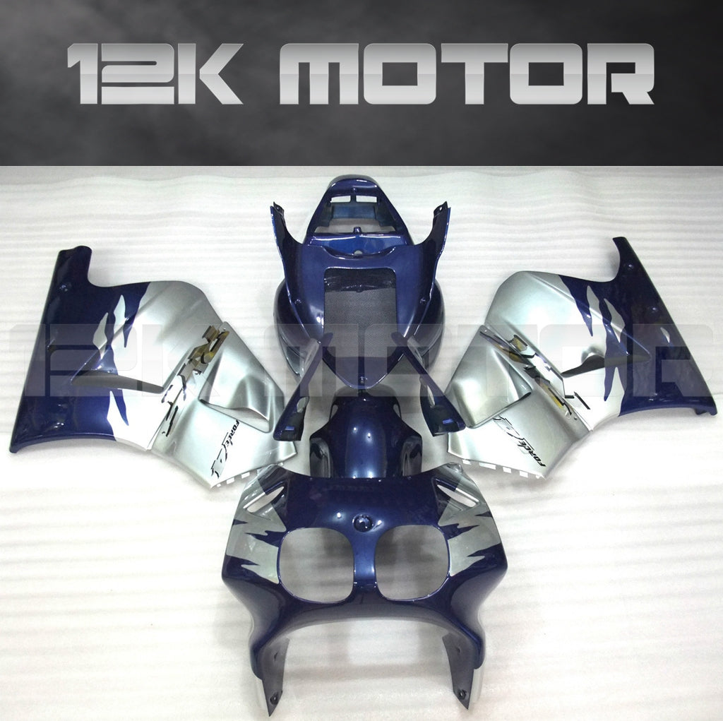 Aftermarket fairing kit for HONDA VFR400R NC30 in blue and silver color, including multiple panels and fairing parts laid out on a flat surface.