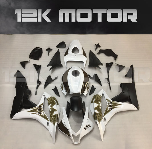 Aftermarket fairing kit for HONDA CBR600RR displayed on a table, featuring a black, white, and gold color scheme.