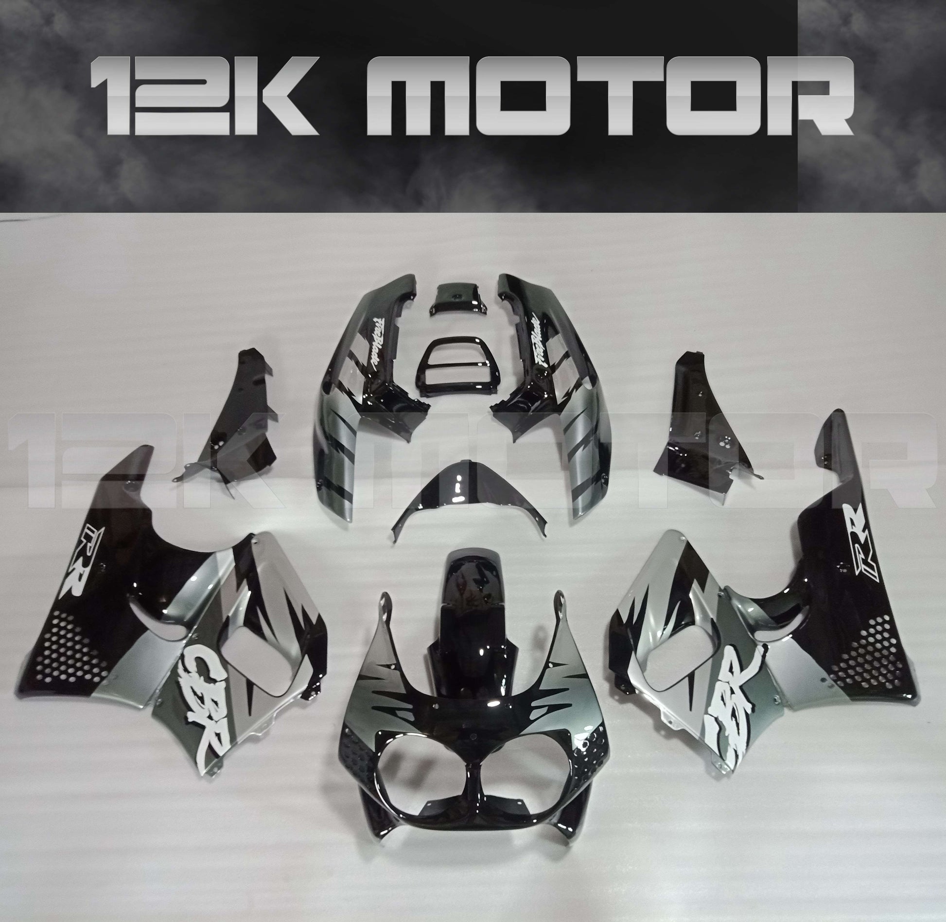 Aftermarket fairing kit for HONDA CBR900RR 1992-1995, displayed without the motorcycle, consisting of multiple black and white fairing pieces with visible branding and design details.