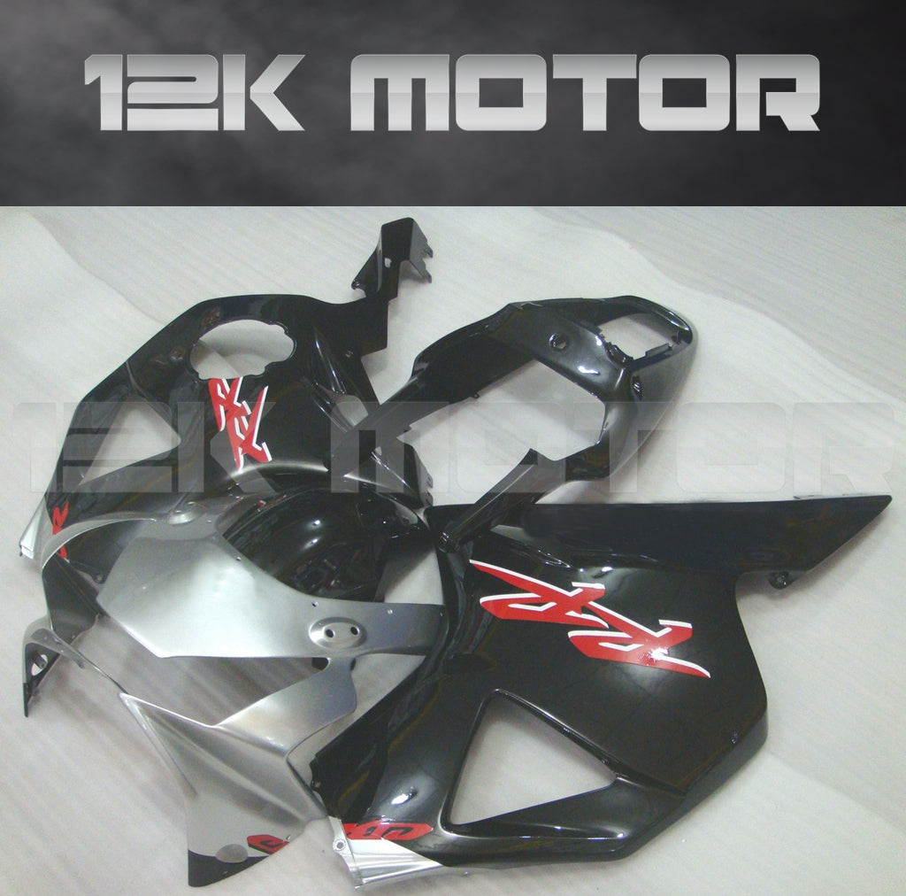 Aftermarket fairing kit for HONDA CBR954RR motorcycle, featuring black and red panels with graphic designs, displayed with '12K MOTOR' branding.