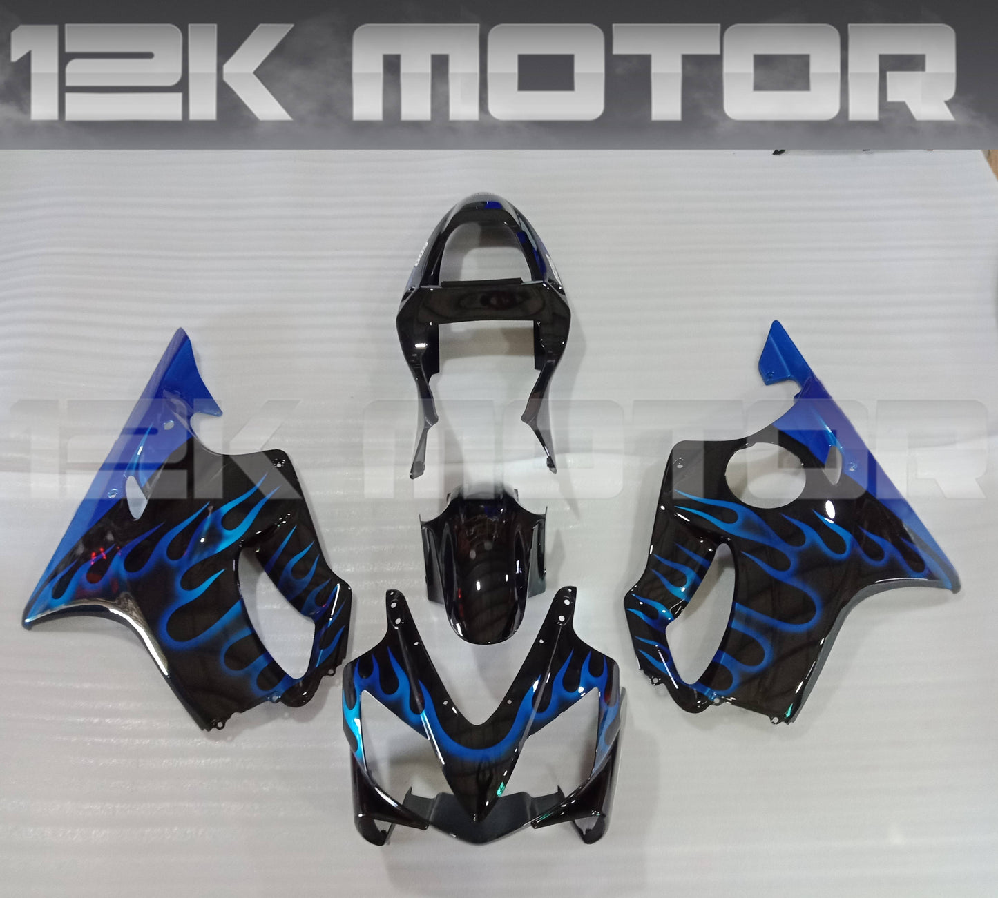 Aftermarket fairing kit for HONDA CBR600 F4i 2001 2002 2003 displayed on a table, featuring a blue and black color scheme with a flame design.