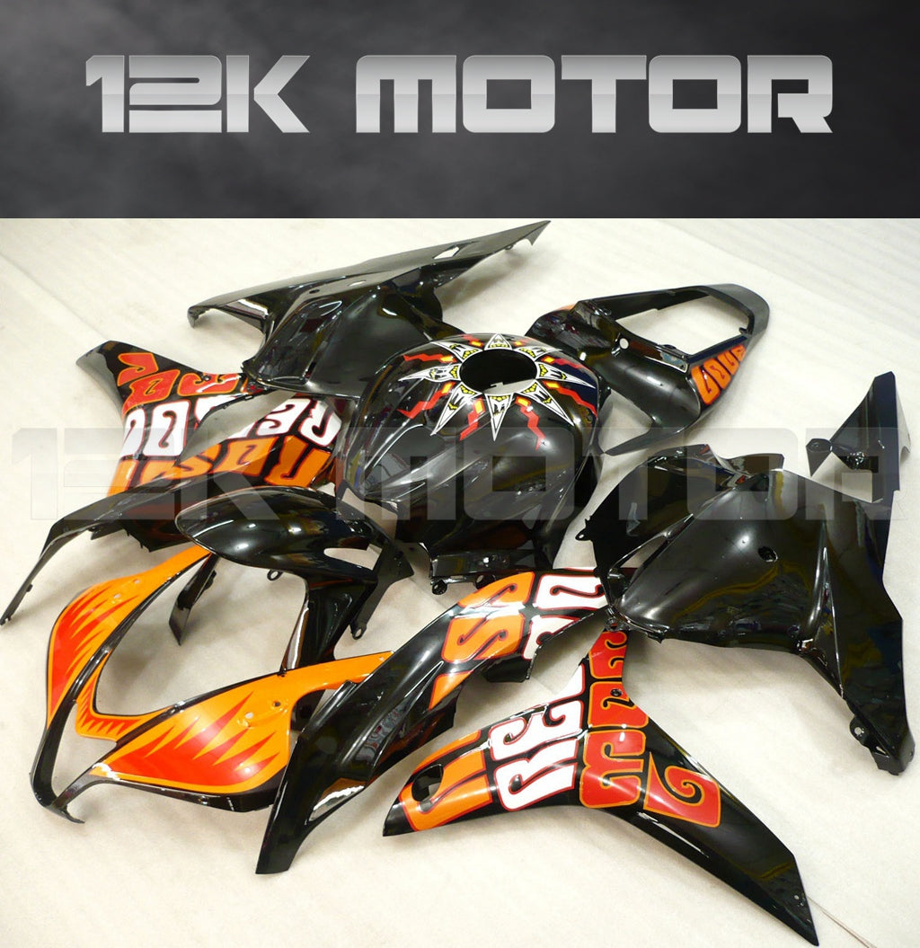 Aftermarket black and orange fairing set for HONDA CBR600RR 2009-2012, displayed without being installed on a motorcycle.