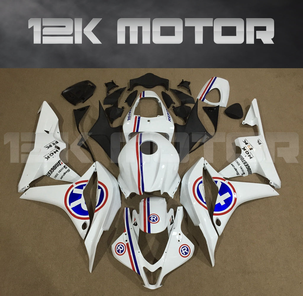 Aftermarket white fairing kit for Honda CBR600RR motorcycle, laid out on a table with the 12K Motor logo.