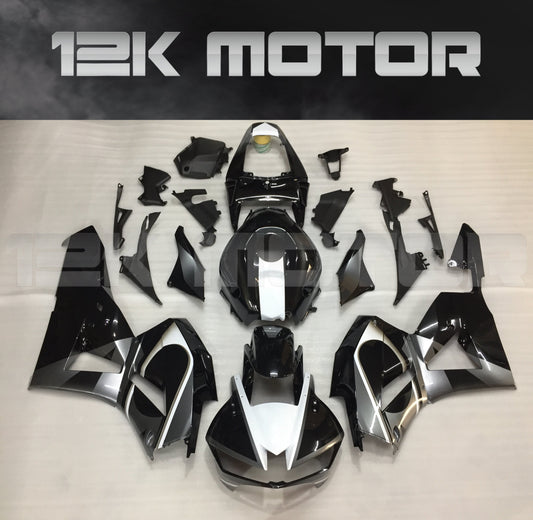 Aftermarket black fairing kit for Honda CBR600RR motorcycle, displayed on a table with the brand name 12K Motor visible.