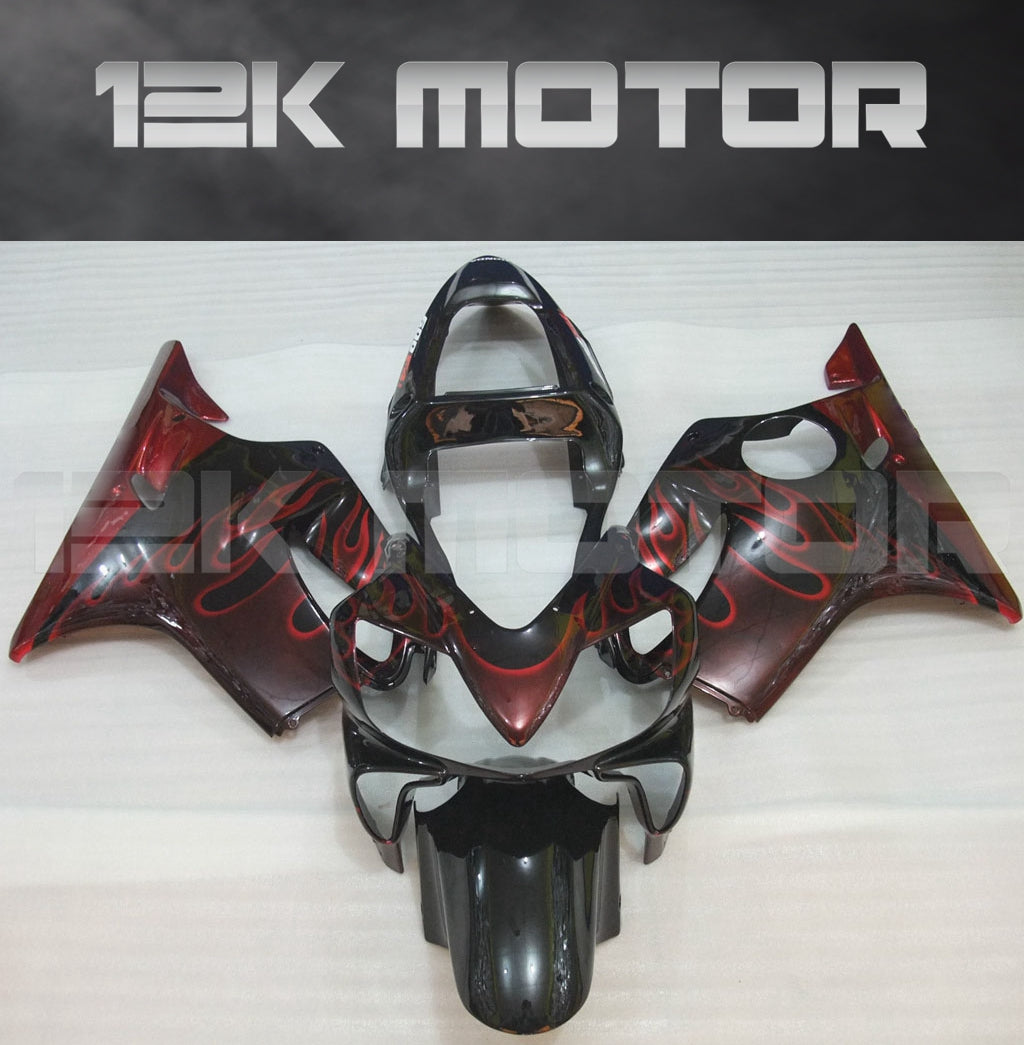 Aftermarket fairing kit for HONDA CBR600 F4i, featuring dark red and black color with a flame design, displayed on a flat surface.