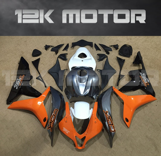 A set of aftermarket fairing kits for HONDA CBR600RR motorcycles, including various panels and parts in black, orange, and gray colors.
