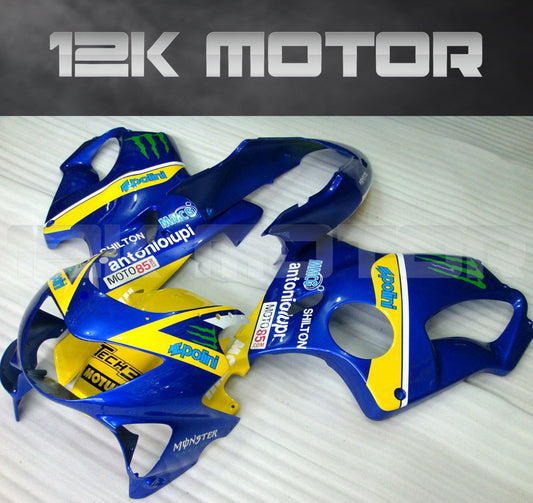 A set of aftermarket motorcycle fairings in blue, yellow, and black colors with '12K MOTOR' branding and various model details.