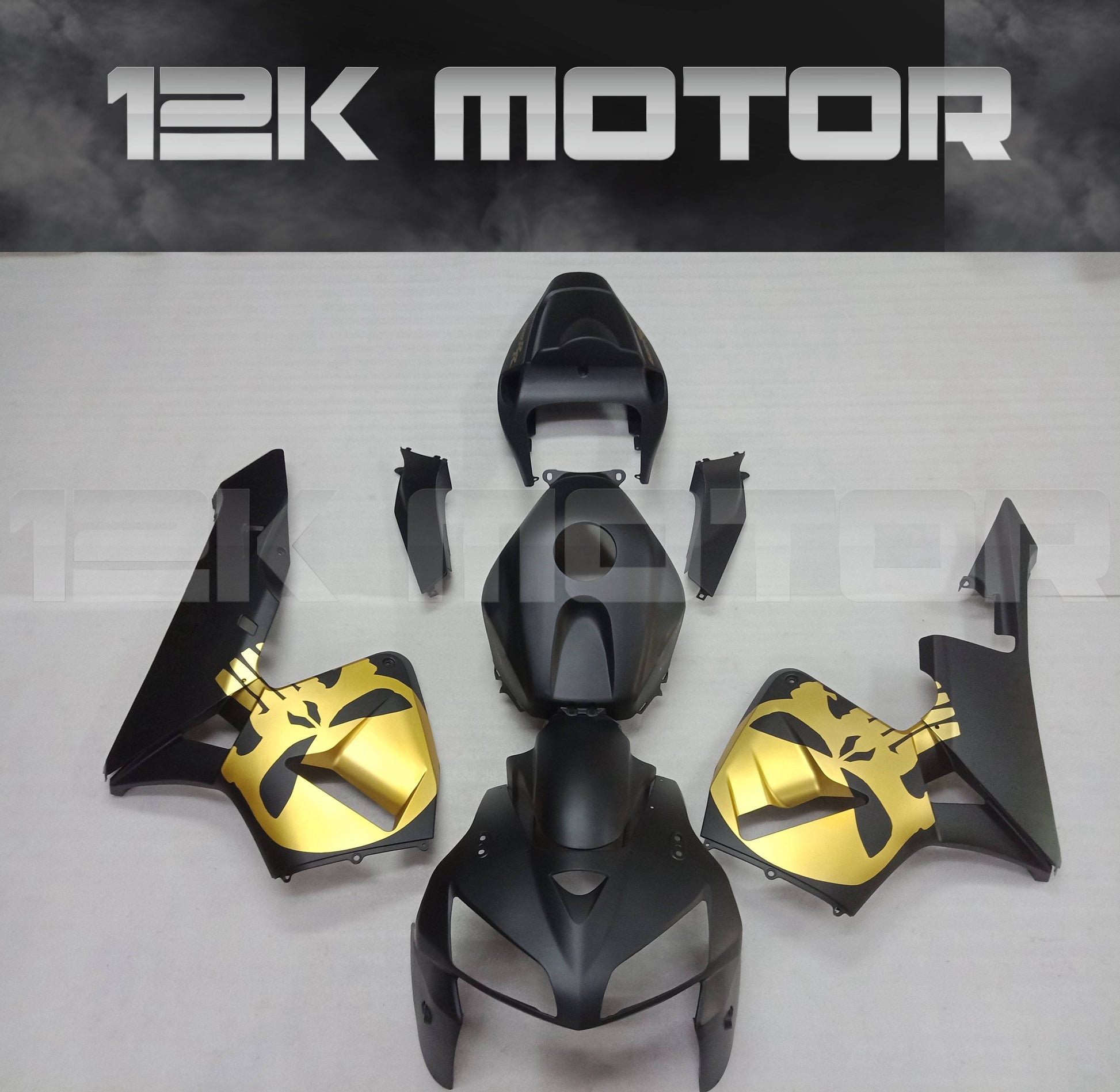 Aftermarket motorcycle fairing kit for HONDA CBR600RR in black, gold, and gray colors, displayed on a flat surface.