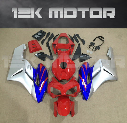 Aftermarket fairing kit for HONDA CBR1000RR motorcycle, featuring panels in red, blue, and silver colors laid out on a flat surface.