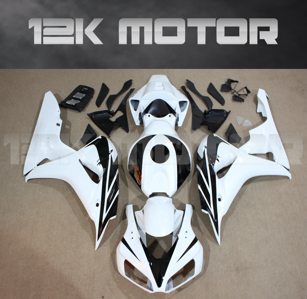 Aftermarket fairing kit for HONDA CBR1000RR motorcycle, displayed as a set of white plastic panels and parts on a table.