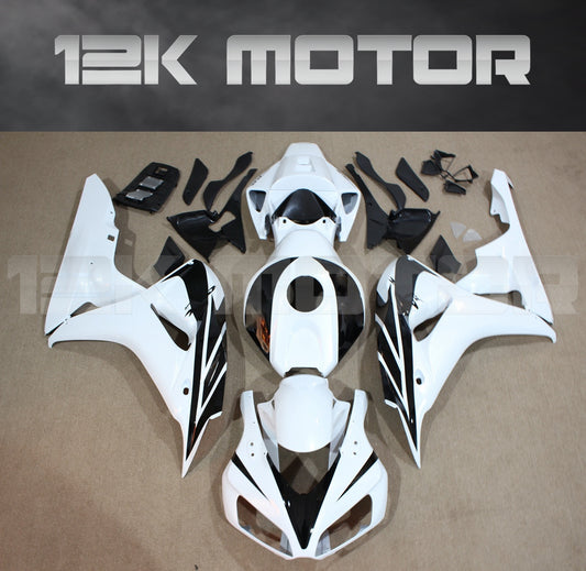 Aftermarket fairing kit for HONDA CBR1000RR motorcycle, displayed as a set of white plastic panels and parts on a table.