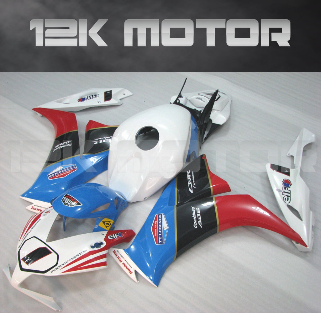 Aftermarket fairing kit for HONDA CBR1000RR motorcycle, featuring blue and orange design with white accents, displayed on a table.