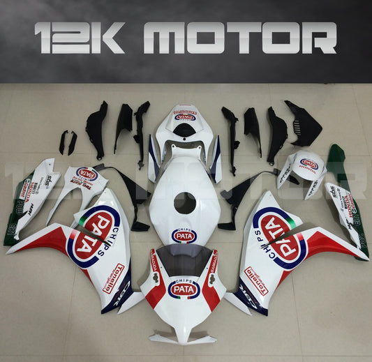 Aftermarket fairing kit for HONDA CBR1000RR displayed on a table, featuring a white base with red and blue accents, and PATA sponsor logos.