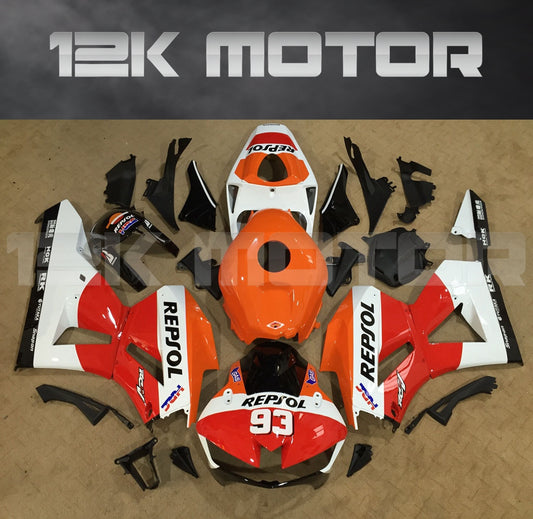 A collection of motorcycle fairing panels in various colors, including red and white, with the text '12K MOTOR' prominently displayed.