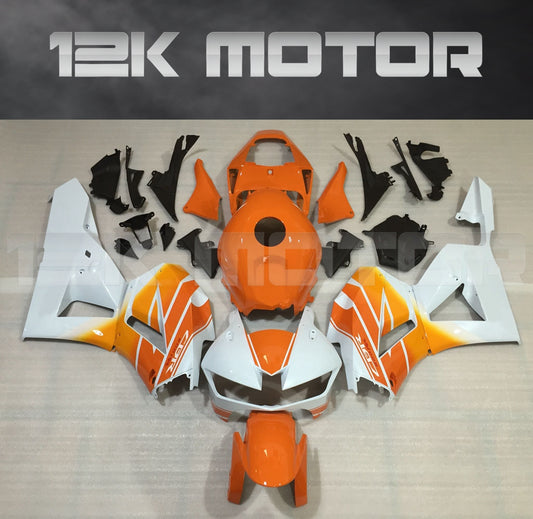 An aftermarket fairing kit for Honda CBR600RR motorcycles, featuring various panels in white, orange, and black colors with a prominent Repsol logo.
