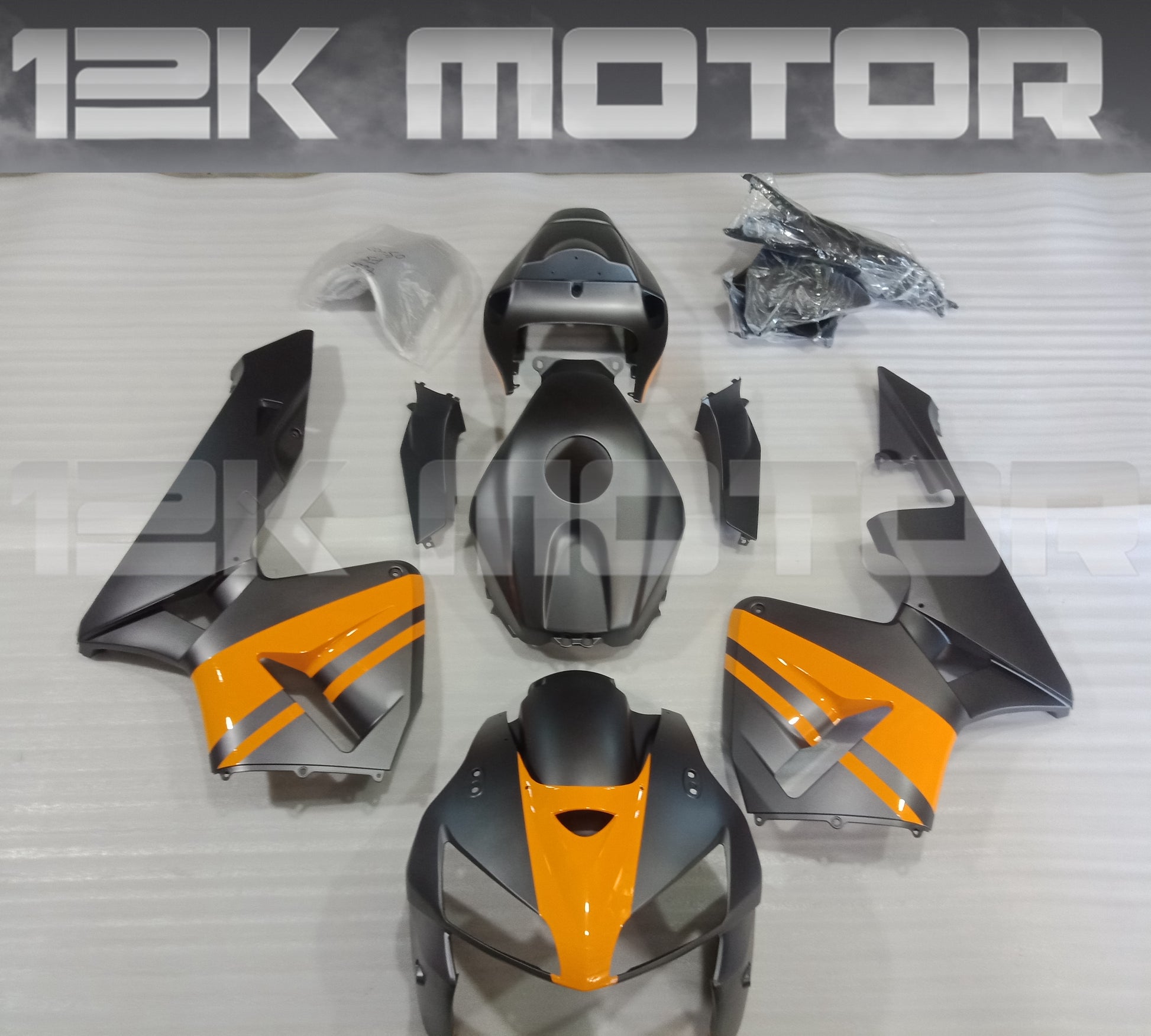 Set of motorcycle fairings for HONDA CBR600RR in Matt Dark Grey with Yellow, including various panels such as front fairing, side panels, and rear fairing, along with a clear windscreen and fairing bolts.