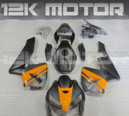 Set of motorcycle fairings for HONDA CBR600RR in Matt Dark Grey with Yellow, including various panels such as front fairing, side panels, and rear fairing, along with a clear windscreen and fairing bolts.