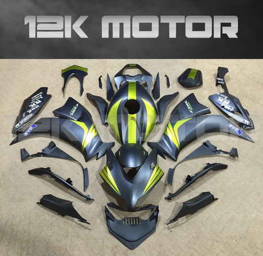 Aftermarket fairing kit for HONDA CBR1000RR motorcycle, featuring a matte finish in black with green and yellow accents, laid out on a flat surface.