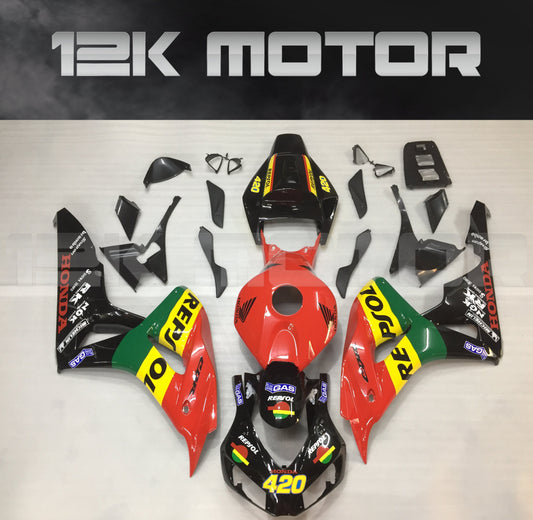 Aftermarket fairing kit for HONDA CBR1000RR motorcycle, displayed on a table, featuring a mix of black, red, green, and yellow colors with sponsor logos.